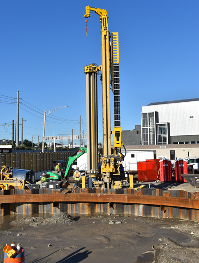B)	Drilling and Installation of Freeze Pipes, Shaft 18B-1 Queens, New York. (Courtesy of Keller, North America)