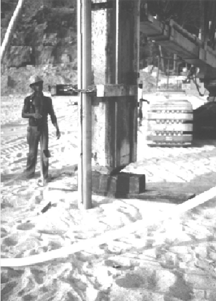 Casing and plastic tubing used for placement of explosive charges at depth for blast densification. (Photograph courtesy of James K. Mitchell.)