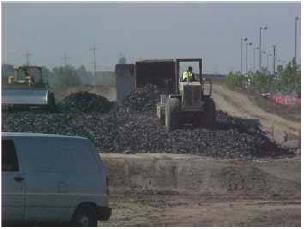 Shredded tires being used as fill for highway embankment construction. From Stevens (2007).