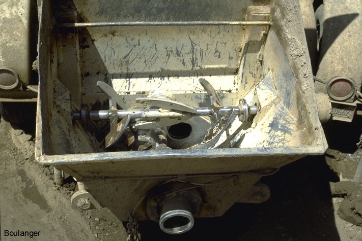 Paddles in the hopper of the grout pump thoroughly mix the grout materials. (Courtesy of Dr. Ross Boulanger, UC Davis). Paddles in the hopper of the grout pump thoroughly mix the grout materials. (Courtesy of Dr. Ross Boulanger, UC Davis).