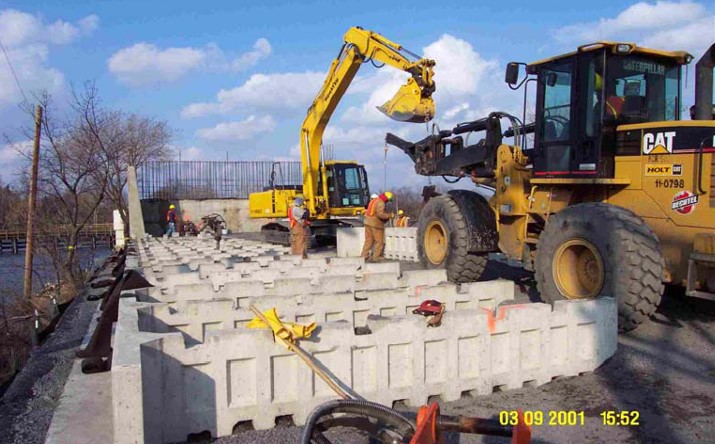 Column-supported T-Wall installation From FHWA (2004) Column-supported T-Wall installation From FHWA (2004)