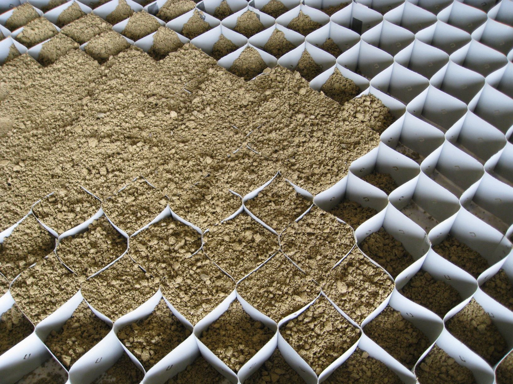 Geocell infilled with soil. Courtesy Jie Han, University of Kansas. Geocell infilled with soil. Courtesy Jie Han, University of Kansas.