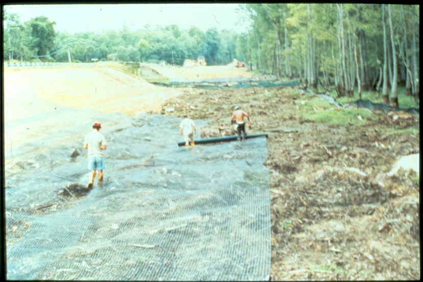 Placing geosynthetic reinforcement prior to filling. Courtesy Ryan Berg. Placing geosynthetic reinforcement prior to filling. Courtesy Ryan Berg.