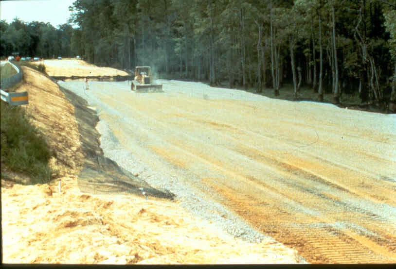 Placing granular material over geosynthetic reinforcement. Courtesy Ryan Berg. Placing granular material over geosynthetic reinforcement. Courtesy Ryan Berg.