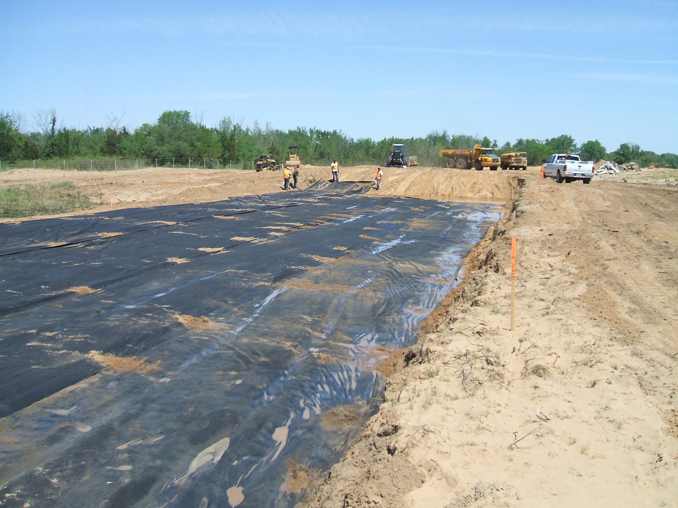 Placement of geosynthetic in roadway. Courtesy Kansas Department of Transportation. Placement of geosynthetic in roadway. Courtesy Kansas Department of Transportation.