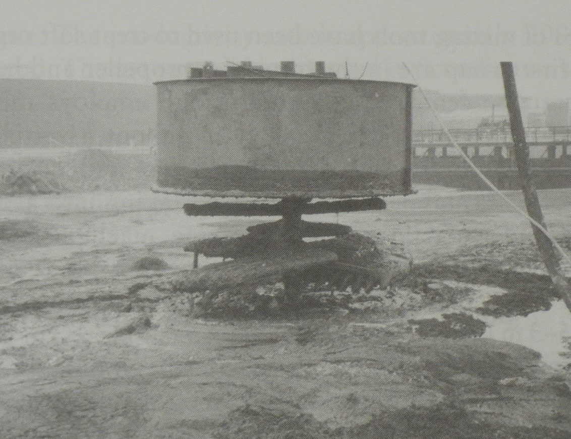 Shallow soil mixing auger with dust control hood for dry method. From Topolnicki (2004). Shallow soil mixing auger with dust control hood for dry method. From Topolnicki (2004).