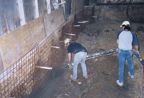 Shotcrete application on a screw-in soil nail wall.Courtesy of Chance Civil Construction.