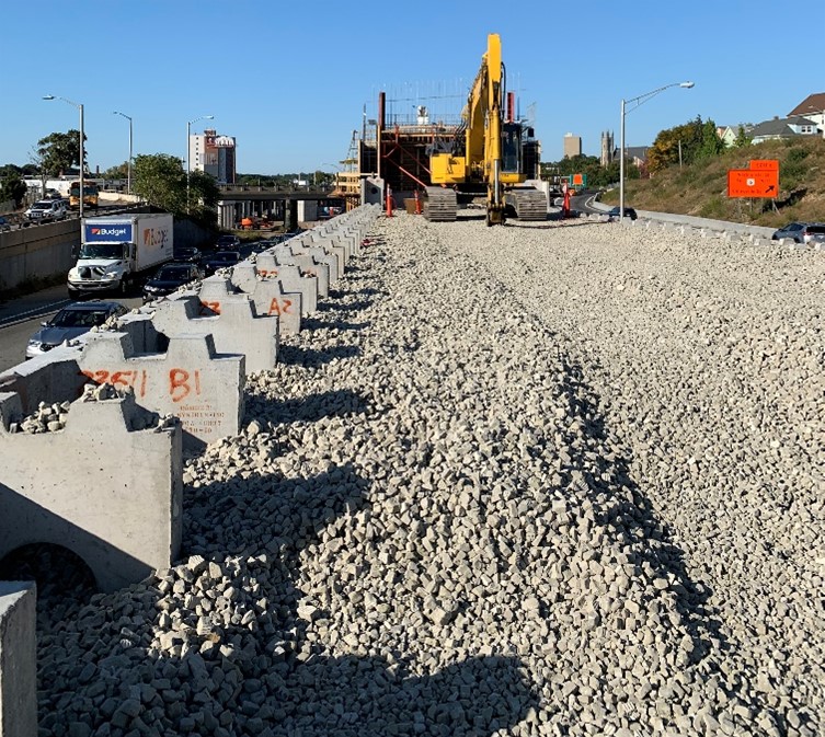 Closeup photograph of MSEW and fill materials during construction.