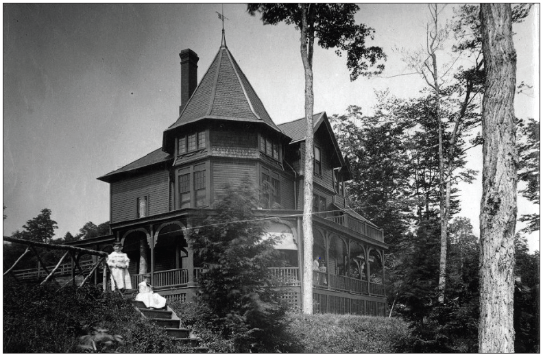 Black and white photo of a Victorian house
