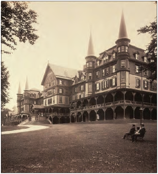 Black and white photo of the Mountain House Hotel, a large Victorian building with gingerbread trim