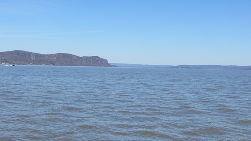 View of Hudson river, taken from a boat. Image is largely filled with gray-green water.