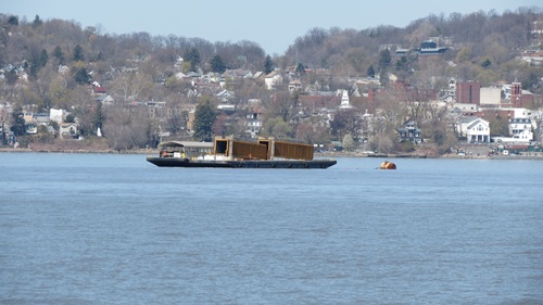 Barges haul deck girders for the new bridge.