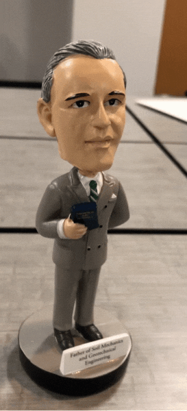 Animated gif of a bobblehead statuette depicting Karl Terzaghi. Someone gently touches the statuette to make its head bobble.