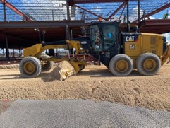 Placement of fill materials on geogrid overlying soft subgrade soils.