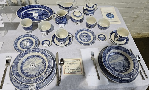 Color photo of table set with blue and white china