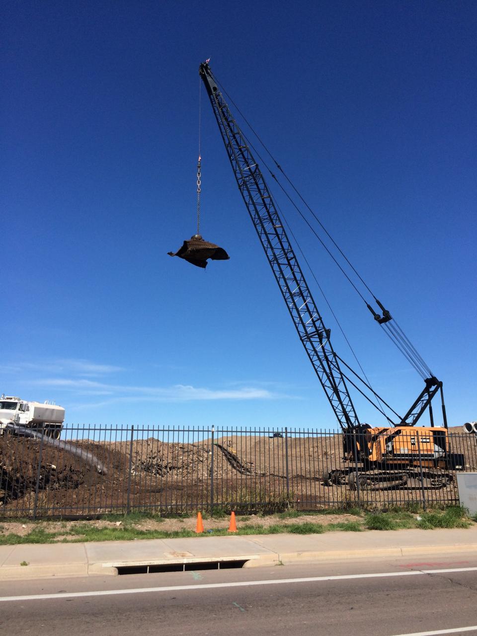 Deep Dynamic Compaction near an existing roadway (Photo Courtesy of Densification, Inc.)