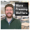 Photo of blog author James Press. An elementary school classroom is in the background. Text reads "More Pressing Matters." Text is written in the style used to teach students print handwriting, with a chalkboard background.